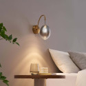 Applique dorata LED ad arco con globo ovale sospeso - Nuvéo