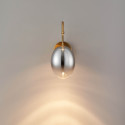 Applique dorata LED ad arco con globo ovale sospeso - Nuvéo