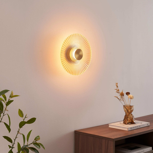 Applique di design dorata con disco plissettato...