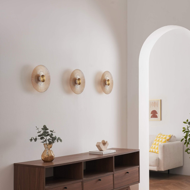 Applique di design dorata con disco plissettato...