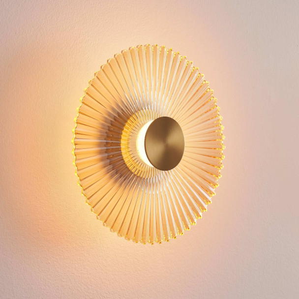 Applique di design dorata con disco plissettato...