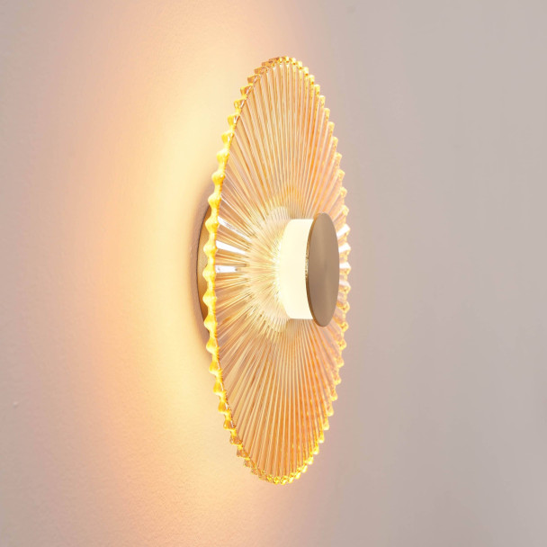 Applique di design dorata con disco plissettato...