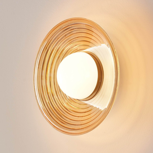 Applique LED di design rotonda in vetro ambrato...